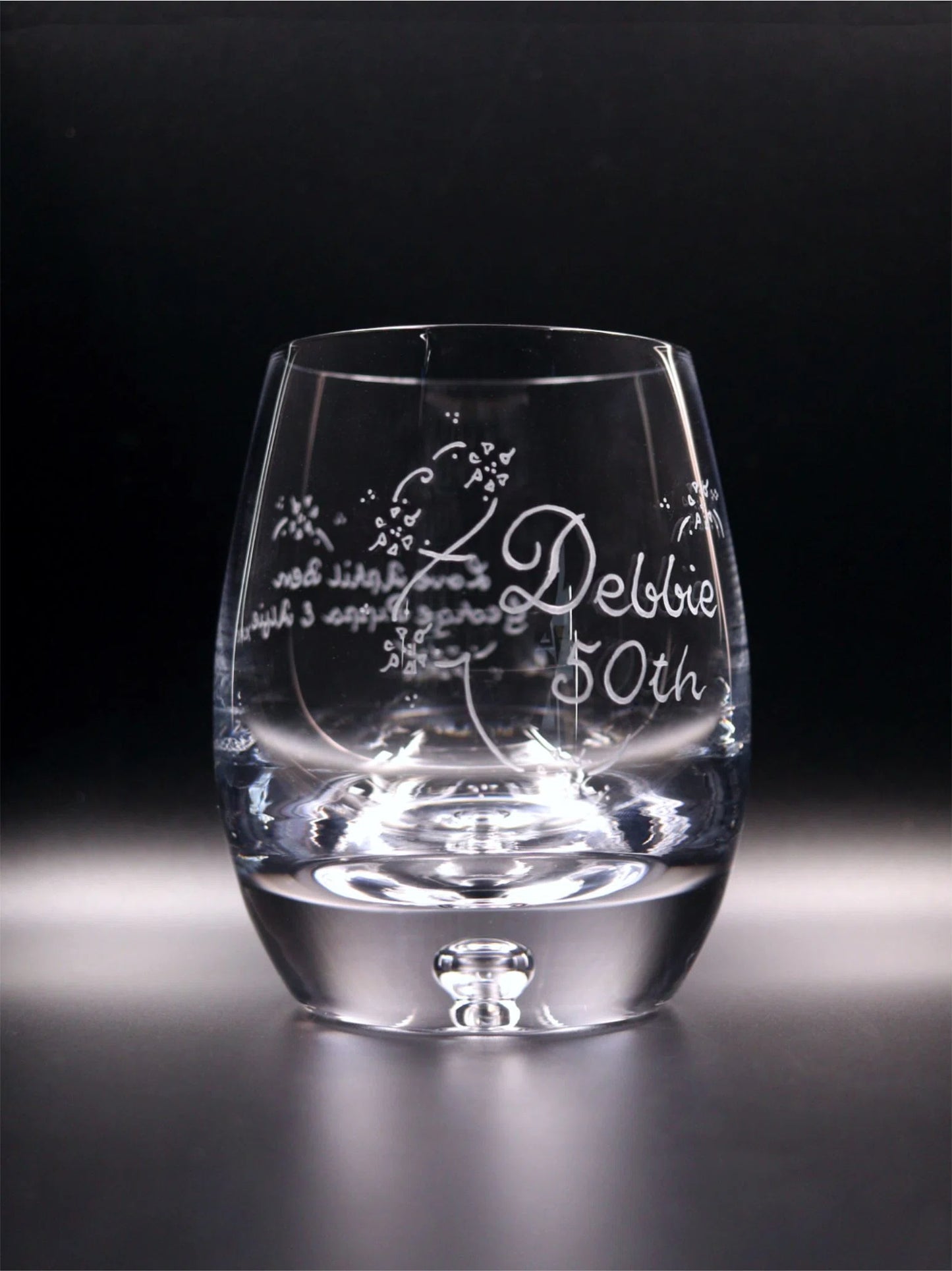 Bubble base whisky glass with elegant engraving. Girls Name, Number, 2 Lines of hand engraving including decorative scroll and flowers.