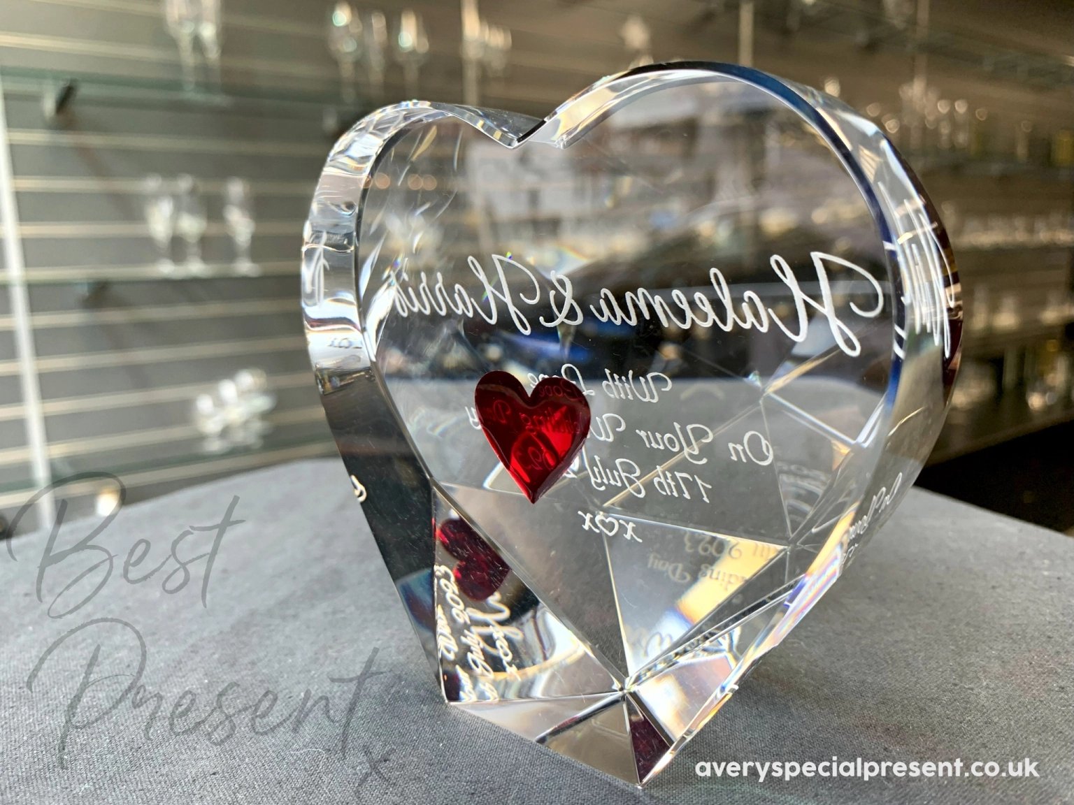 An Optical Crystal Heart, Deeply Engraved Red Heart on the reverse, engraved names and message with a kiss-heart-kiss for a wedding - stylish Reverse Angled View.
